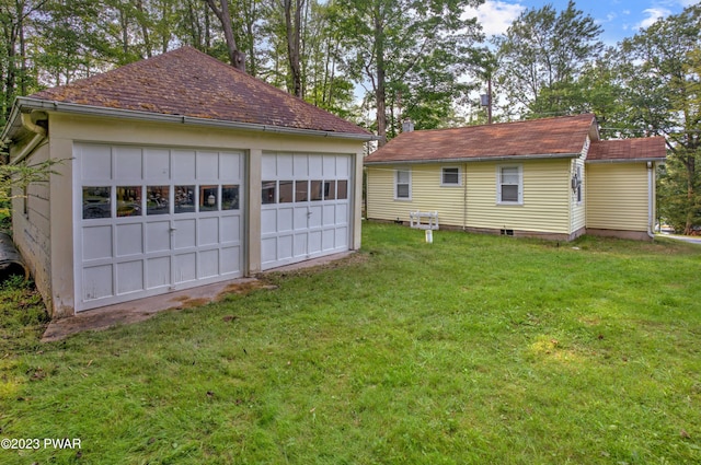 garage with a lawn