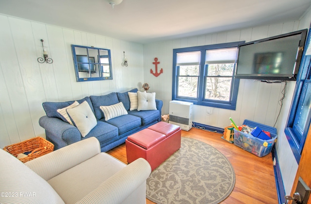 living room featuring hardwood / wood-style flooring and heating unit