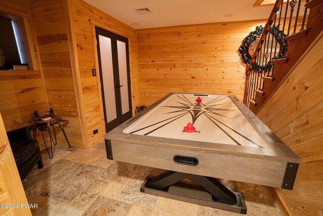 playroom with wooden walls