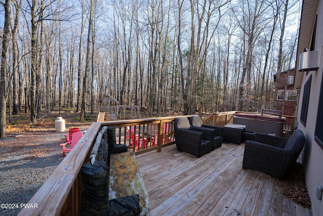 wooden terrace with a playground and a hot tub