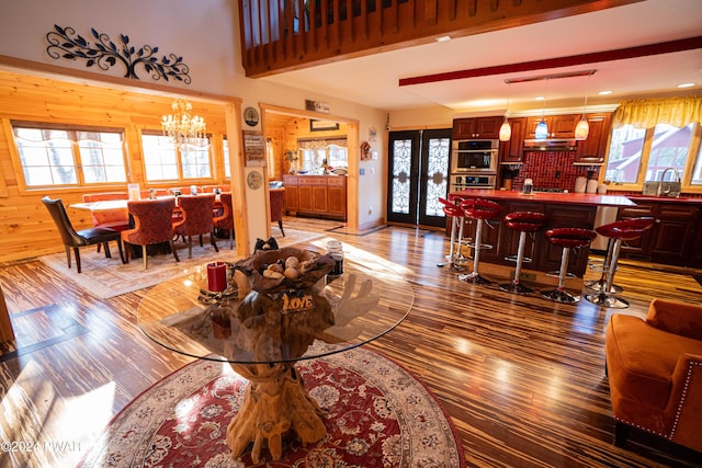 living room with light hardwood / wood-style flooring, a chandelier, and sink