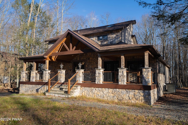 view of front of property with covered porch and central air condition unit