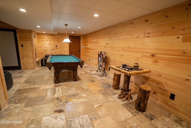 playroom with wooden walls and billiards