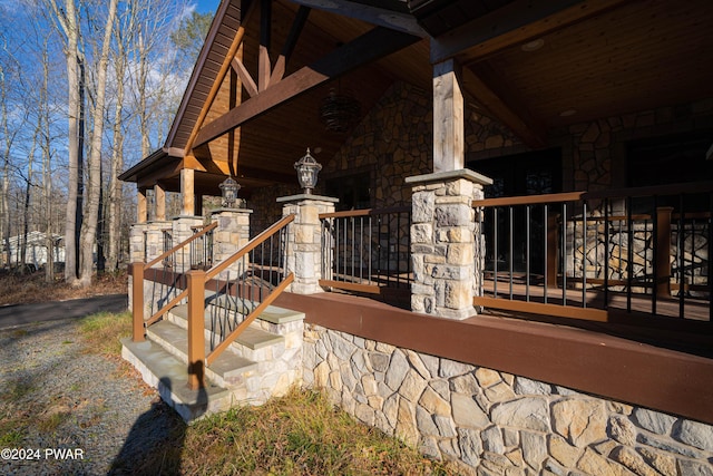 view of side of home featuring a porch