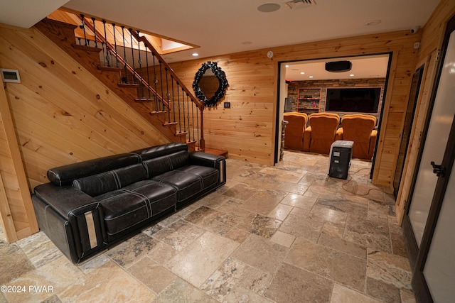 living room featuring wood walls