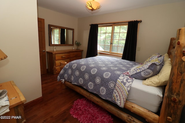 bedroom featuring dark hardwood / wood-style flooring