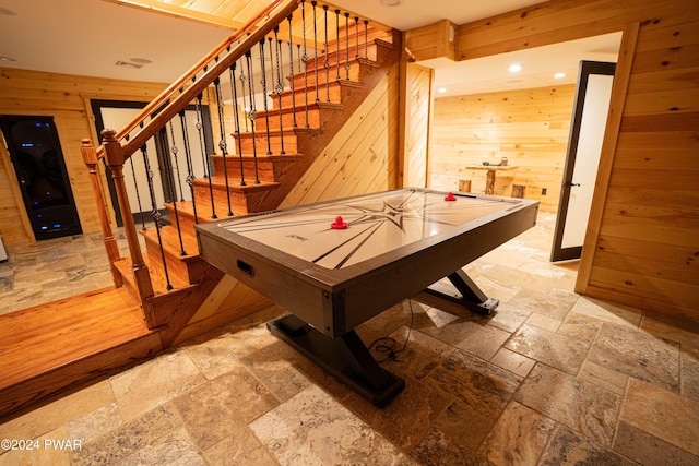 playroom featuring wooden walls