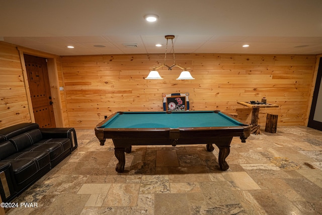 rec room with wooden walls and billiards