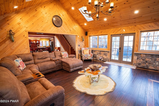 living room with a skylight, wood ceiling, high vaulted ceiling, a chandelier, and dark hardwood / wood-style floors