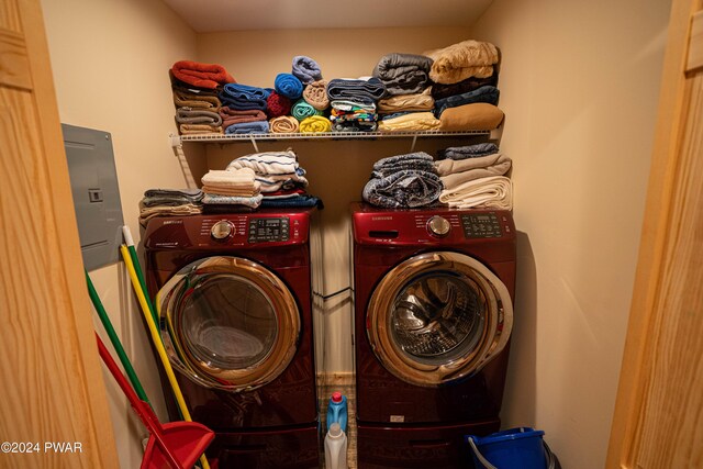 laundry room featuring washing machine and clothes dryer