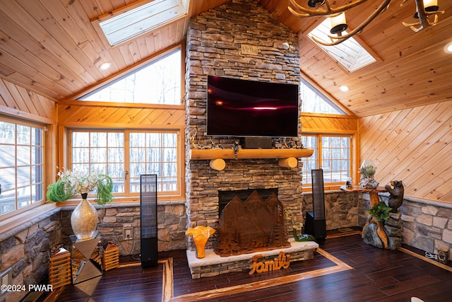 living room featuring wood walls, wood ceiling, dark wood-type flooring, and a skylight