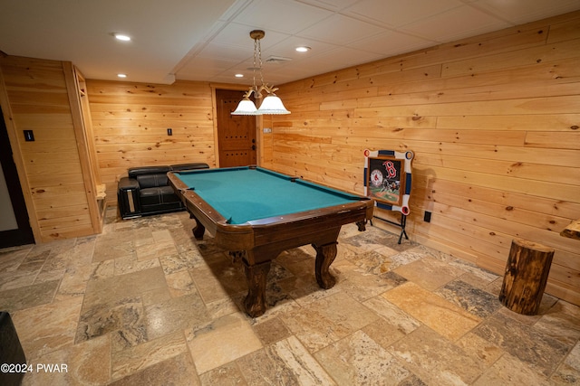 recreation room featuring billiards and wood walls