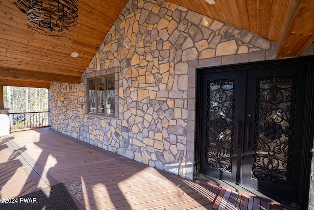 doorway to property featuring french doors and a porch