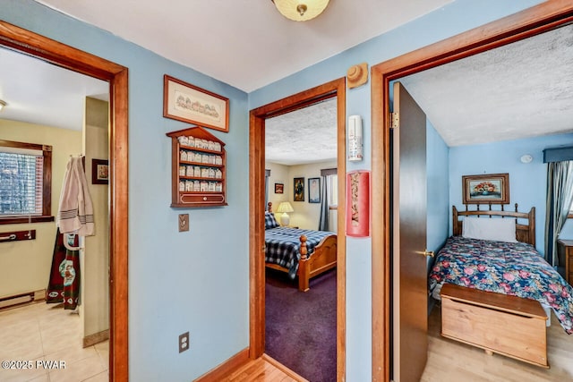 hall with a textured ceiling