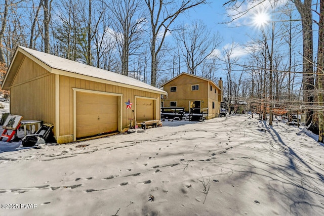 view of snow covered garage