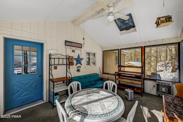 sunroom with cooling unit, ceiling fan, and vaulted ceiling with beams