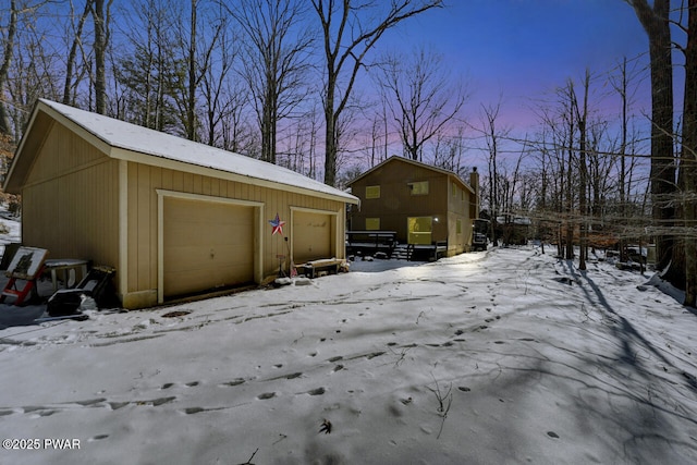 view of snow covered garage