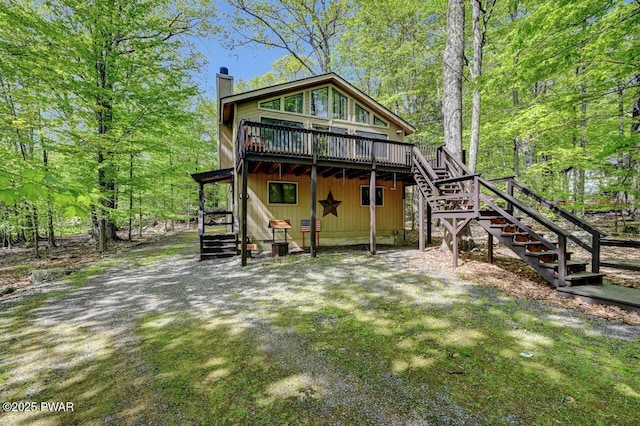 7 Huron Ct Lot 4196, Lake Ariel, PA 18436 - back of property with stairway, a chimney, and a wooden deck