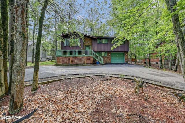1036 Mountain Top Dr, Lake Ariel, PA 18436 - view of front facade with driveway, brick siding, and a garage