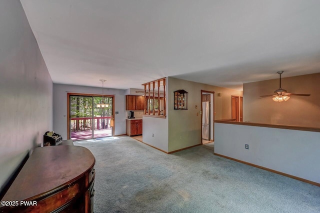 1036 Mountain Top Dr, Lake Ariel, PA 18436 - living area with light carpet, ceiling fan, and baseboards