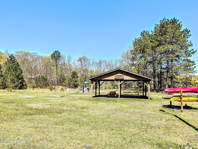 view of yard featuring a gazebo and a playground