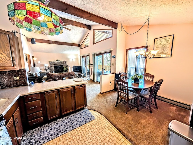 kitchen featuring light colored carpet, a brick fireplace, a textured ceiling, a chandelier, and beamed ceiling