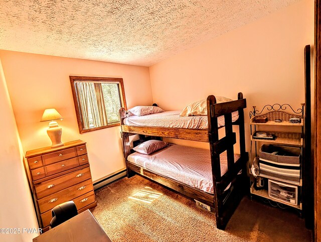 bedroom with dark carpet, a baseboard radiator, and a textured ceiling