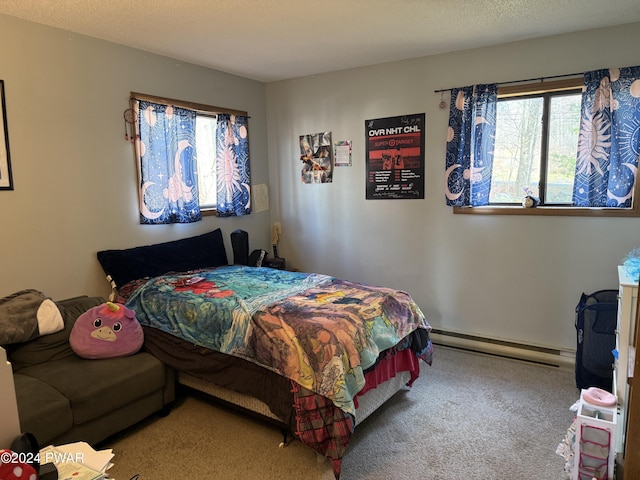 bedroom with carpet floors and baseboard heating