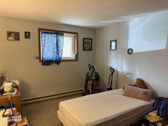 carpeted bedroom with a textured ceiling and a baseboard radiator