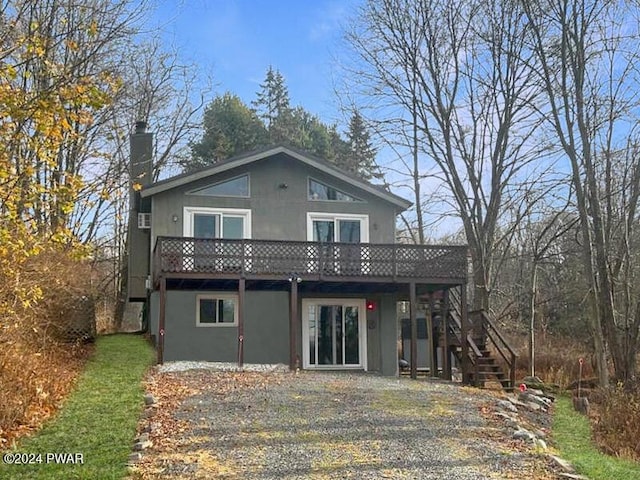 rear view of property with a deck