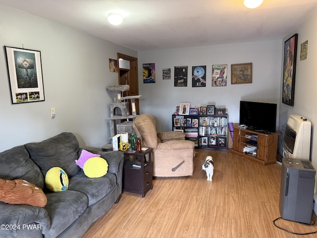 living room featuring light hardwood / wood-style floors and heating unit