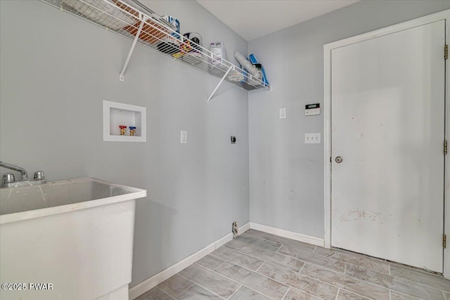 washroom with electric dryer hookup, sink, and washer hookup