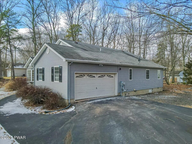 view of property exterior featuring a garage