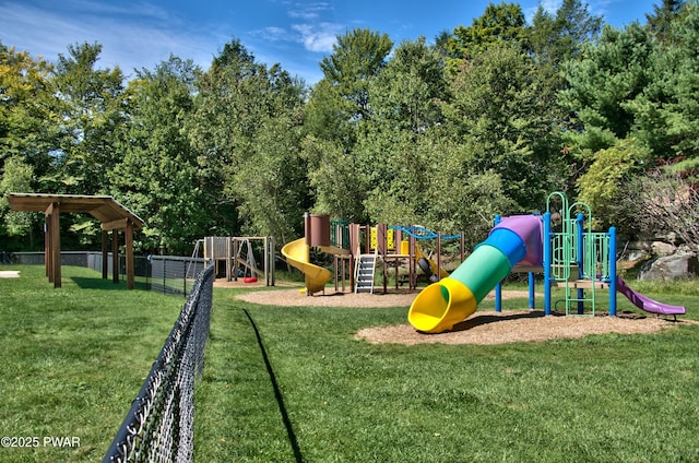 community play area with a yard and fence