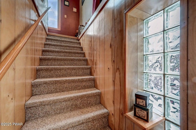 staircase with wooden walls