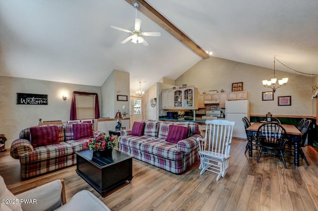 living area featuring light wood-type flooring, high vaulted ceiling, beam ceiling, and ceiling fan with notable chandelier