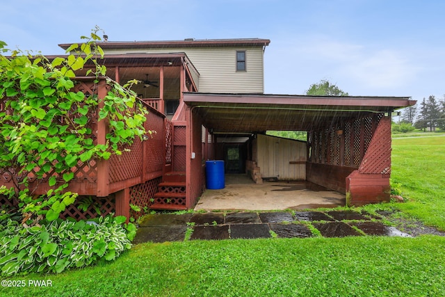 198 State Route 690, Springbrook Township, PA 18444 - view of parking featuring a ceiling fan and a carport