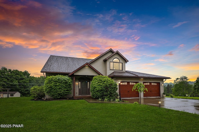 198 State Route 690, Springbrook Township, PA 18444 - view of front of house with concrete driveway, a yard, a garage, and a shingled roof