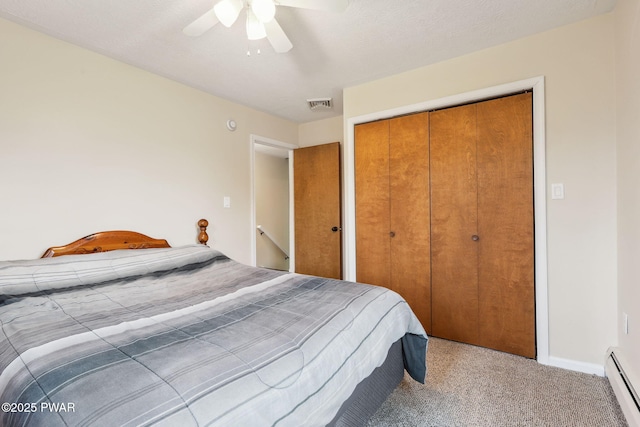 198 State Route 690, Springbrook Township, PA 18444 - bedroom featuring a baseboard radiator, a closet, carpet floors, and ceiling fan