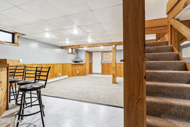 198 State Route 690, Springbrook Township, PA 18444 - bar area with wooden walls, stairway, recessed lighting, a baseboard radiator, and tile patterned floors
