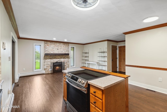 198 State Route 690, Springbrook Township, PA 18444 - kitchen featuring electric range, dark wood-type flooring, brown cabinets, a baseboard heating unit, and a fireplace