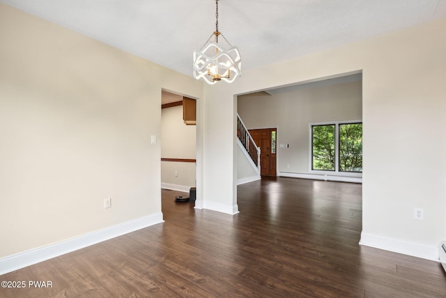 198 State Route 690, Springbrook Township, PA 18444 - unfurnished room with stairs, a chandelier, dark wood-style flooring, and a baseboard heating unit