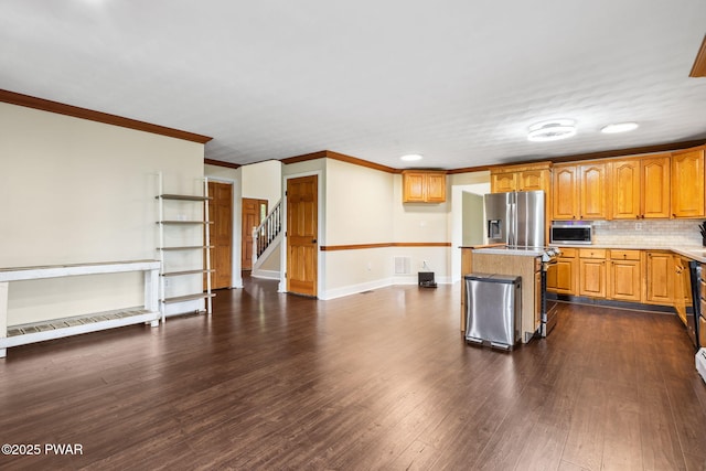 198 State Route 690, Springbrook Township, PA 18444 - kitchen featuring stainless steel appliances, ornamental molding, a center island, dark wood-type flooring, and light countertops