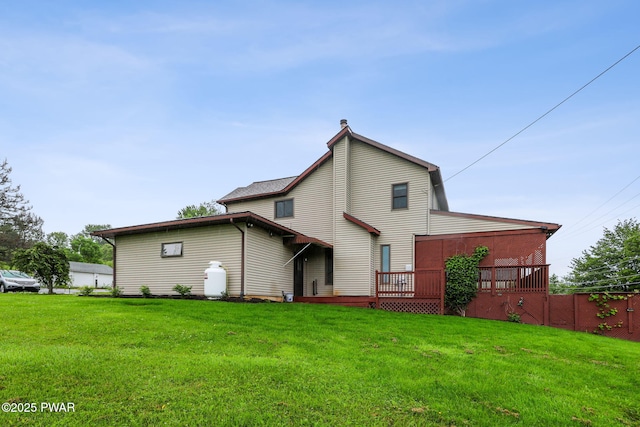 198 State Route 690, Springbrook Township, PA 18444 - rear view of house featuring a yard and a wooden deck