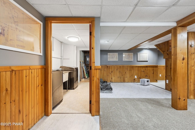 198 State Route 690, Springbrook Township, PA 18444 - finished basement featuring carpet, a paneled ceiling, wood walls, and a wainscoted wall
