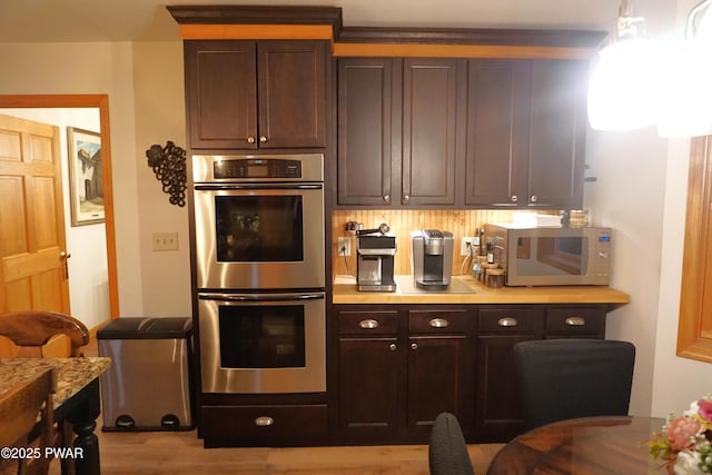 103 Valley Forge Rd, Milford, PA 18337 - kitchen with appliances with stainless steel finishes, light countertops, wood finished floors, and dark brown cabinets
