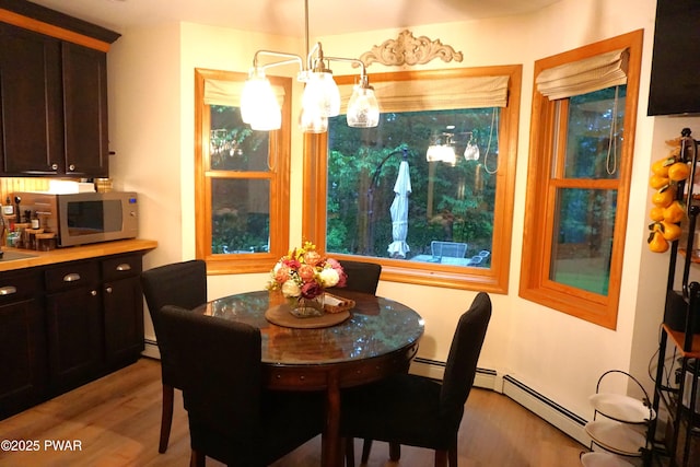 103 Valley Forge Rd, Milford, PA 18337 - dining space with wood finished floors and a chandelier