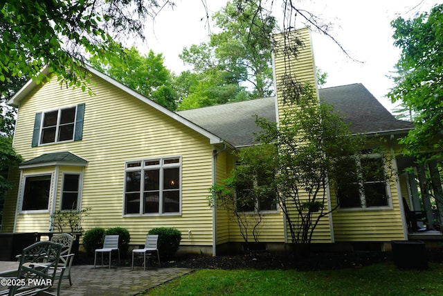103 Valley Forge Rd, Milford, PA 18337 - rear view of house with a chimney, a patio area, and roof with shingles
