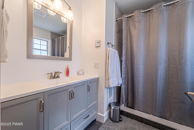 full bath with visible vents, curtained shower, and vanity