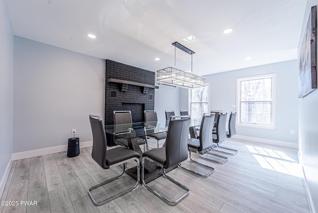 dining area with baseboards, recessed lighting, and light wood-style floors